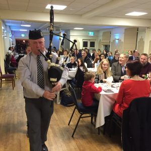 Jim Hanna pipes in the Haggis